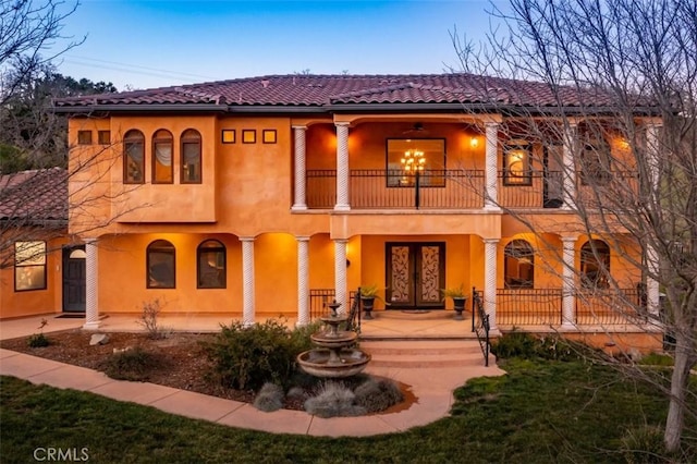 view of front of home with a balcony and covered porch