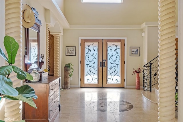 entrance foyer with french doors and ornate columns