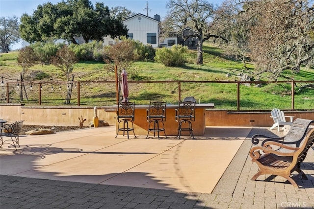 view of patio with a bar