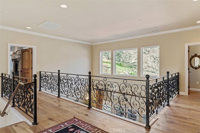 hallway featuring crown molding and hardwood / wood-style flooring