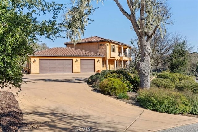 mediterranean / spanish-style house featuring a garage