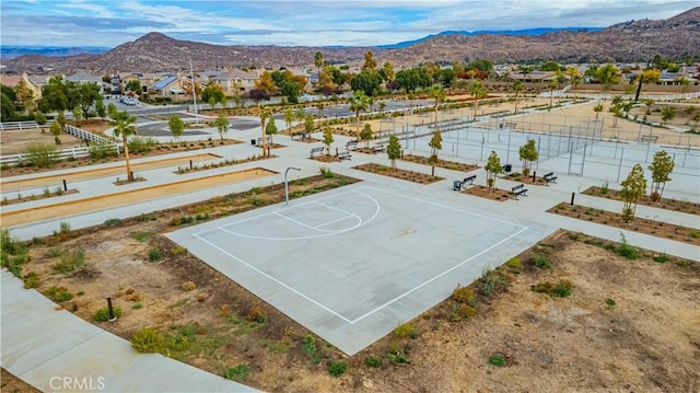 view of basketball court with a mountain view