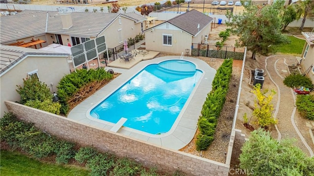 view of pool with a diving board