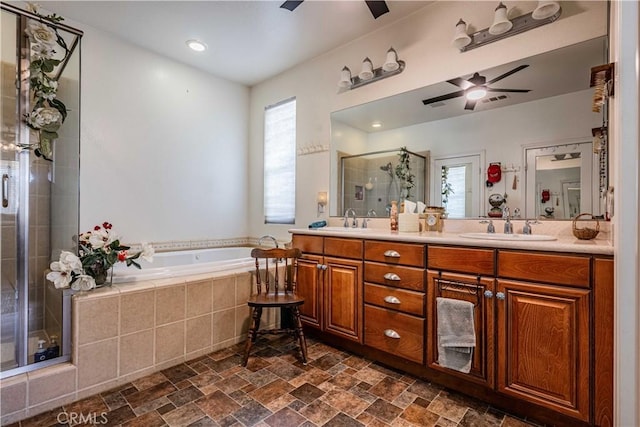 bathroom with vanity and separate shower and tub