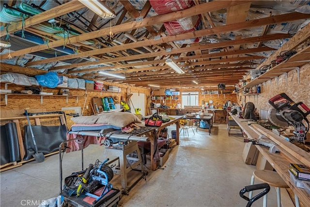 interior space with a workshop area and concrete flooring