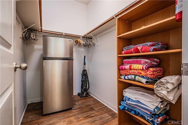 spacious closet featuring wood-type flooring