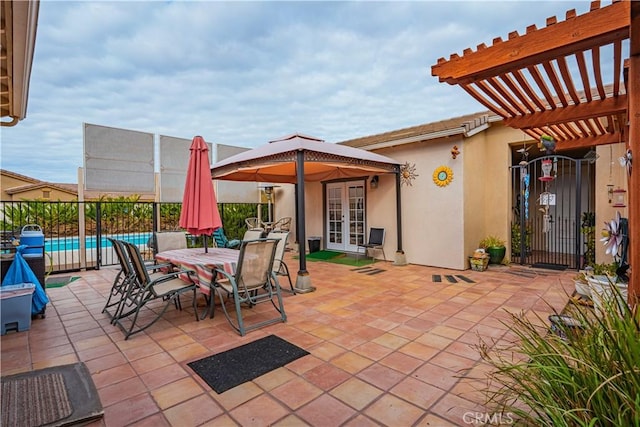 view of patio with a pergola and french doors