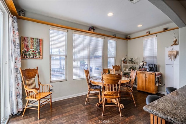 dining space featuring dark hardwood / wood-style flooring