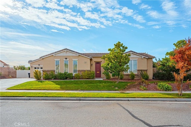 single story home featuring a front lawn