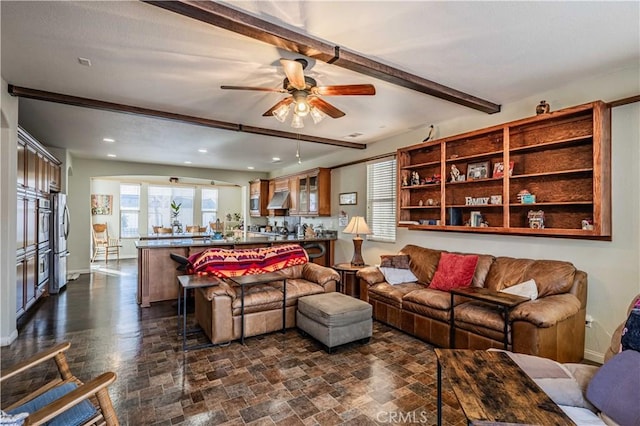 living room with beamed ceiling and ceiling fan