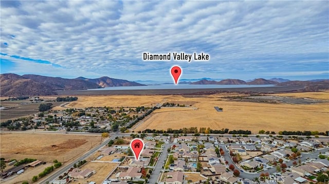 birds eye view of property featuring a mountain view