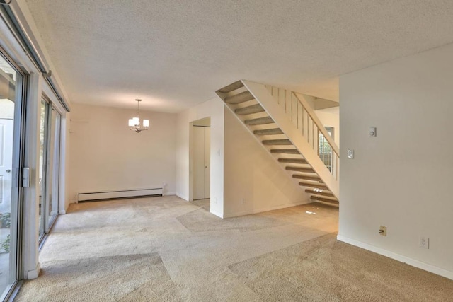 carpeted empty room with a textured ceiling, an inviting chandelier, and baseboard heating