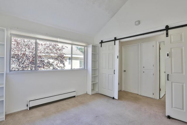 unfurnished bedroom with a barn door, a baseboard radiator, lofted ceiling, and light colored carpet