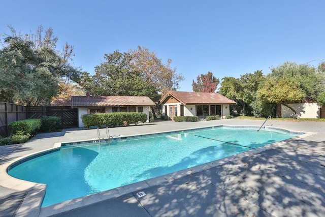 view of swimming pool with a patio