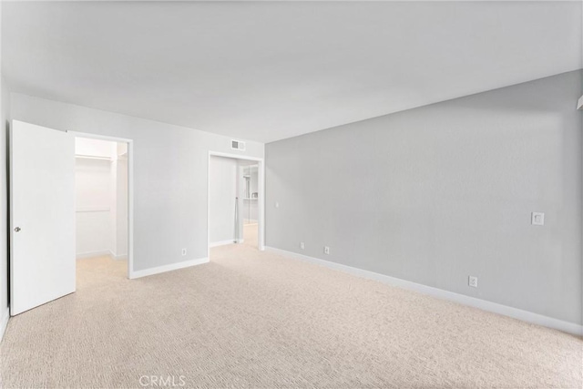 spare room with light colored carpet