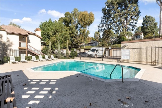 view of pool featuring a patio