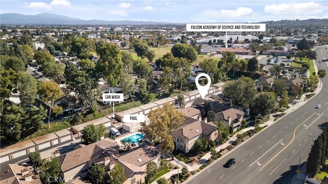 birds eye view of property with a mountain view