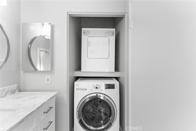 washroom with stacked washer and clothes dryer