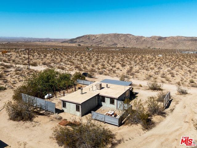 birds eye view of property with a mountain view