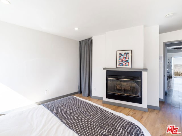 bedroom featuring light wood-type flooring