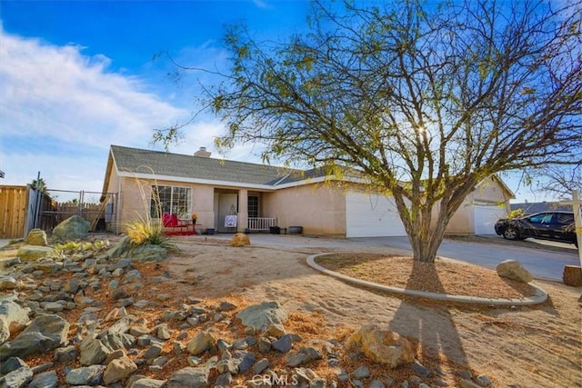 ranch-style house featuring a garage