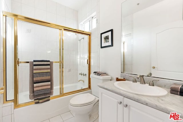 full bathroom featuring vanity, shower / bath combination with glass door, tile patterned flooring, toilet, and radiator heating unit