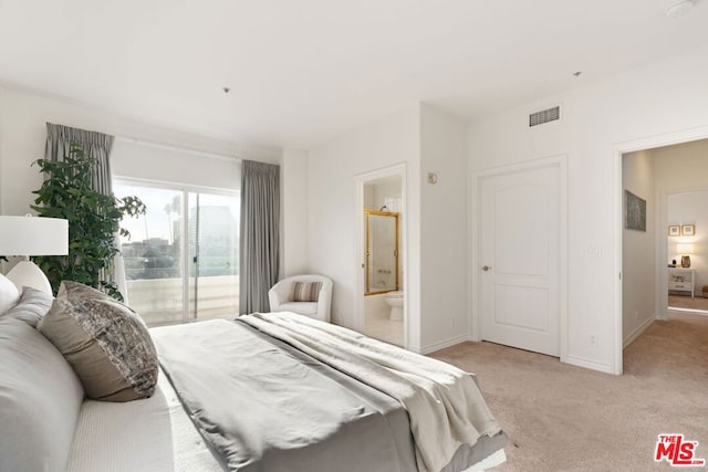 carpeted bedroom featuring connected bathroom and access to outside