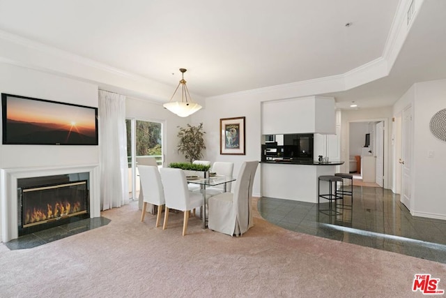 carpeted dining area featuring a raised ceiling and crown molding