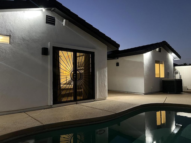 property entrance with central AC and a patio area