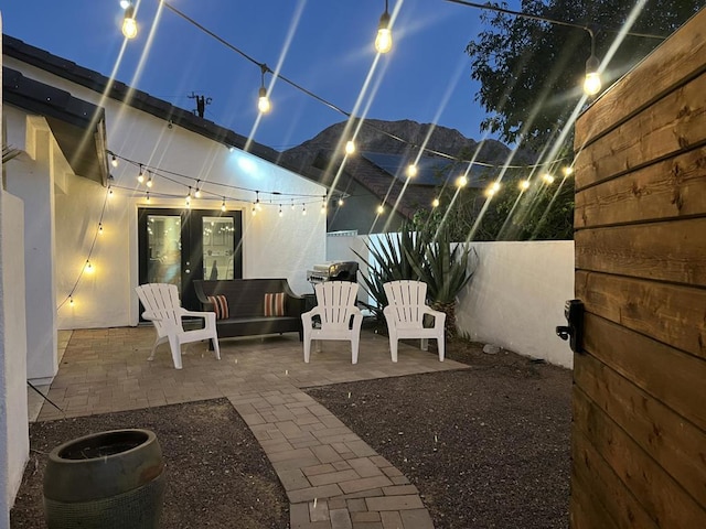 view of patio featuring french doors and a mountain view