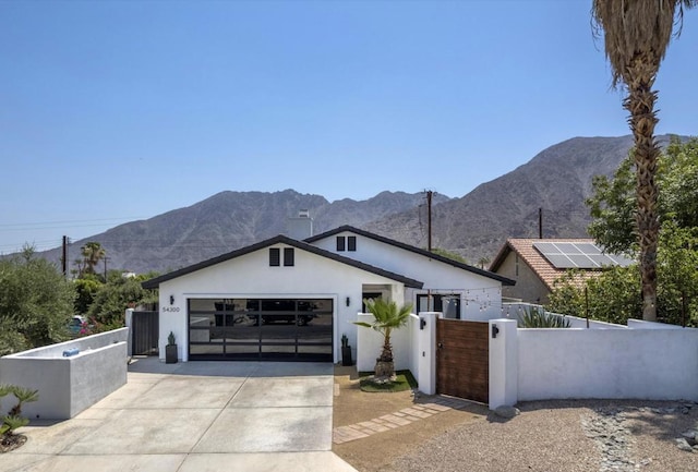 view of front of home featuring a mountain view