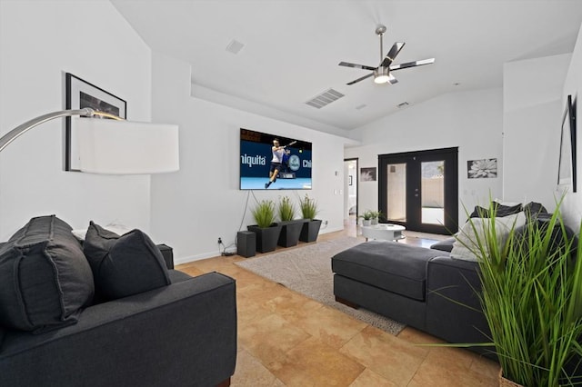 tiled living room with ceiling fan and lofted ceiling