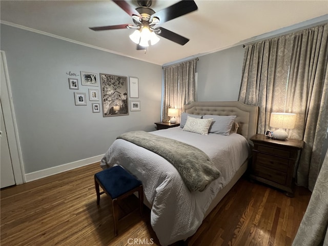 bedroom with ceiling fan, dark hardwood / wood-style flooring, and crown molding