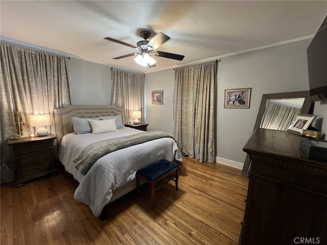 bedroom featuring wood-type flooring, ceiling fan, and crown molding