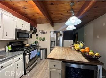 kitchen with wood ceiling, white cabinetry, stainless steel appliances, and wine cooler