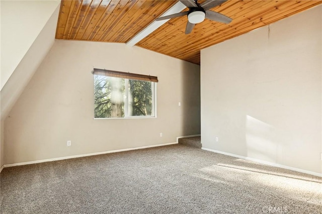 carpeted spare room featuring wood ceiling, ceiling fan, baseboards, and vaulted ceiling with beams