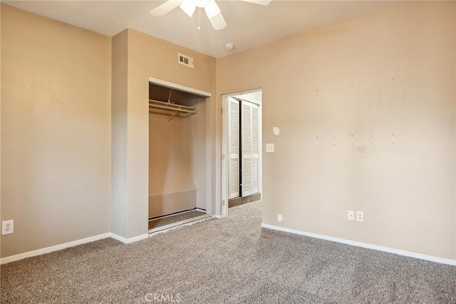 unfurnished bedroom featuring visible vents, baseboards, a closet, a ceiling fan, and carpet floors