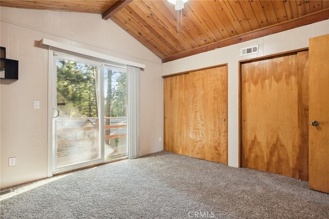 unfurnished bedroom featuring access to outside, two closets, visible vents, carpet floors, and wood ceiling