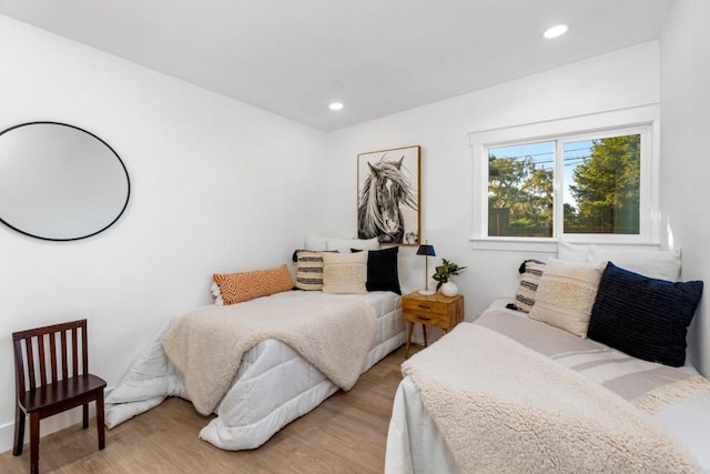 bedroom with light wood-type flooring