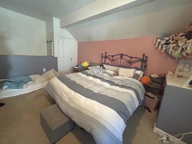 carpeted bedroom with lofted ceiling with beams