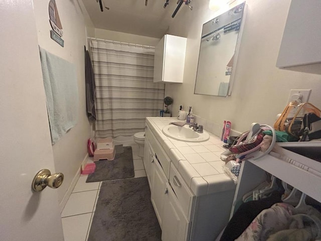 bathroom featuring a shower with curtain, tile patterned flooring, vanity, and toilet