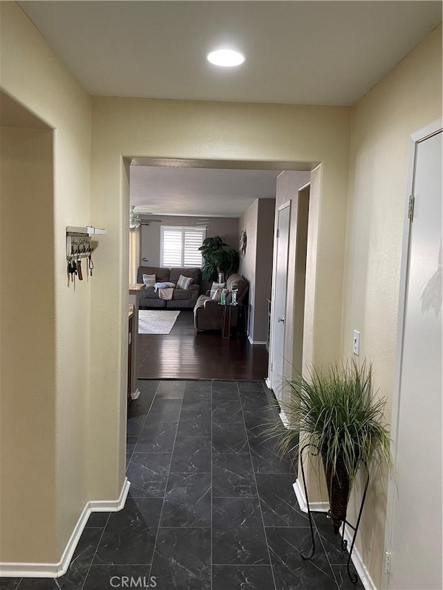 hall with dark wood-type flooring