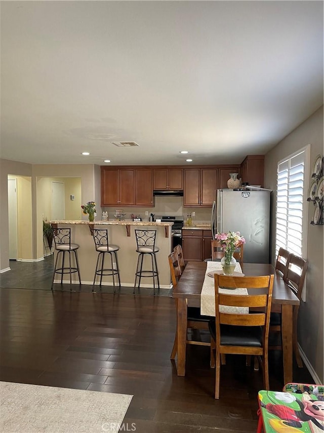 dining room featuring dark hardwood / wood-style flooring