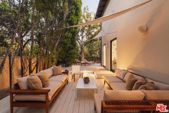 deck with an outdoor hangout area