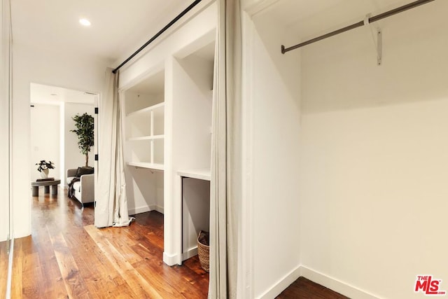 walk in closet featuring hardwood / wood-style floors