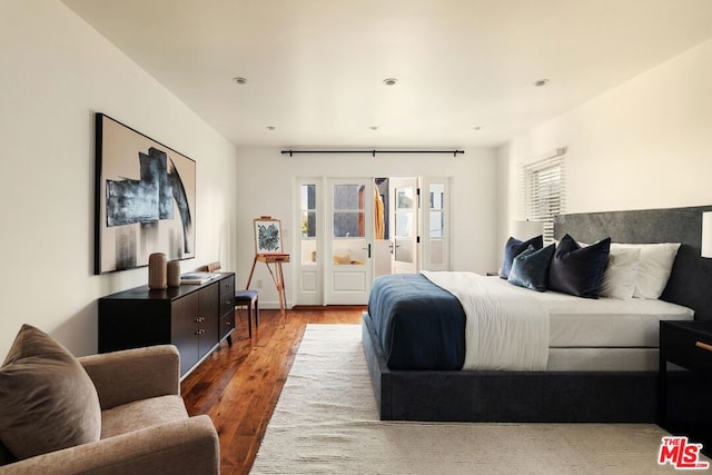 bedroom featuring wood-type flooring