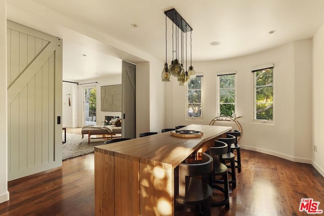 dining space with dark hardwood / wood-style floors