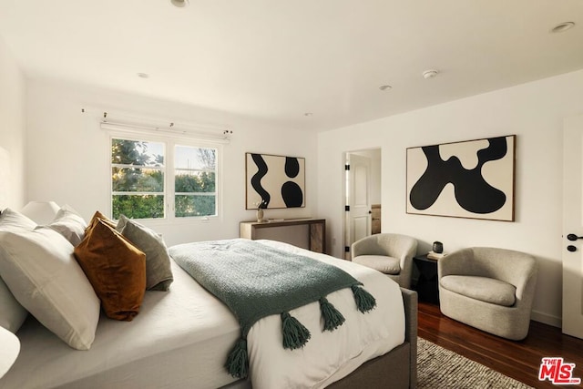 bedroom featuring dark hardwood / wood-style flooring