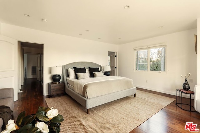 bedroom with wood-type flooring