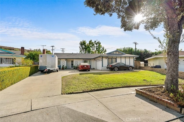 ranch-style home featuring a front yard and a garage